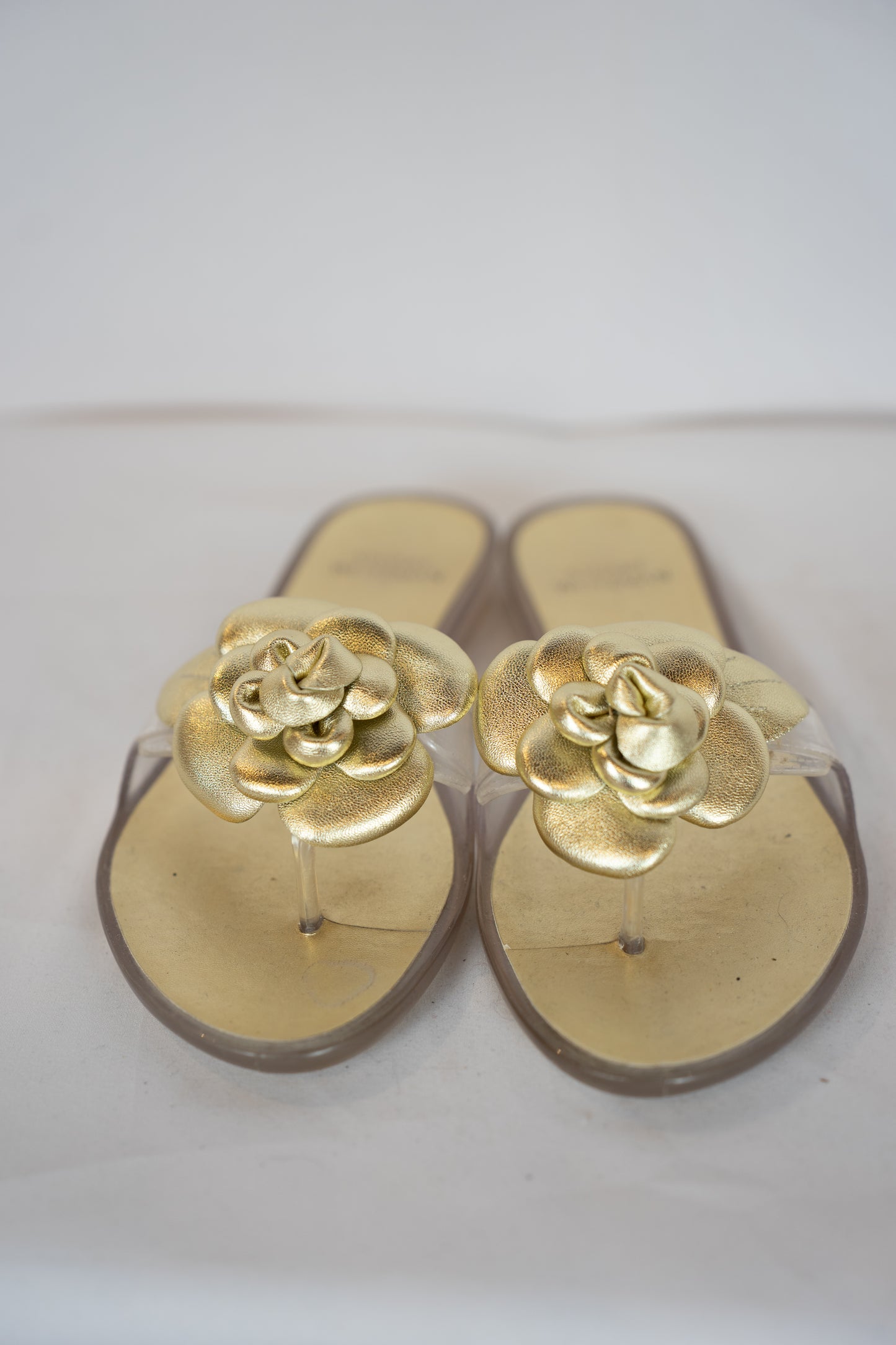 Stuart Weitzman Gold Jelly Flip Flop w/ Flower Detail