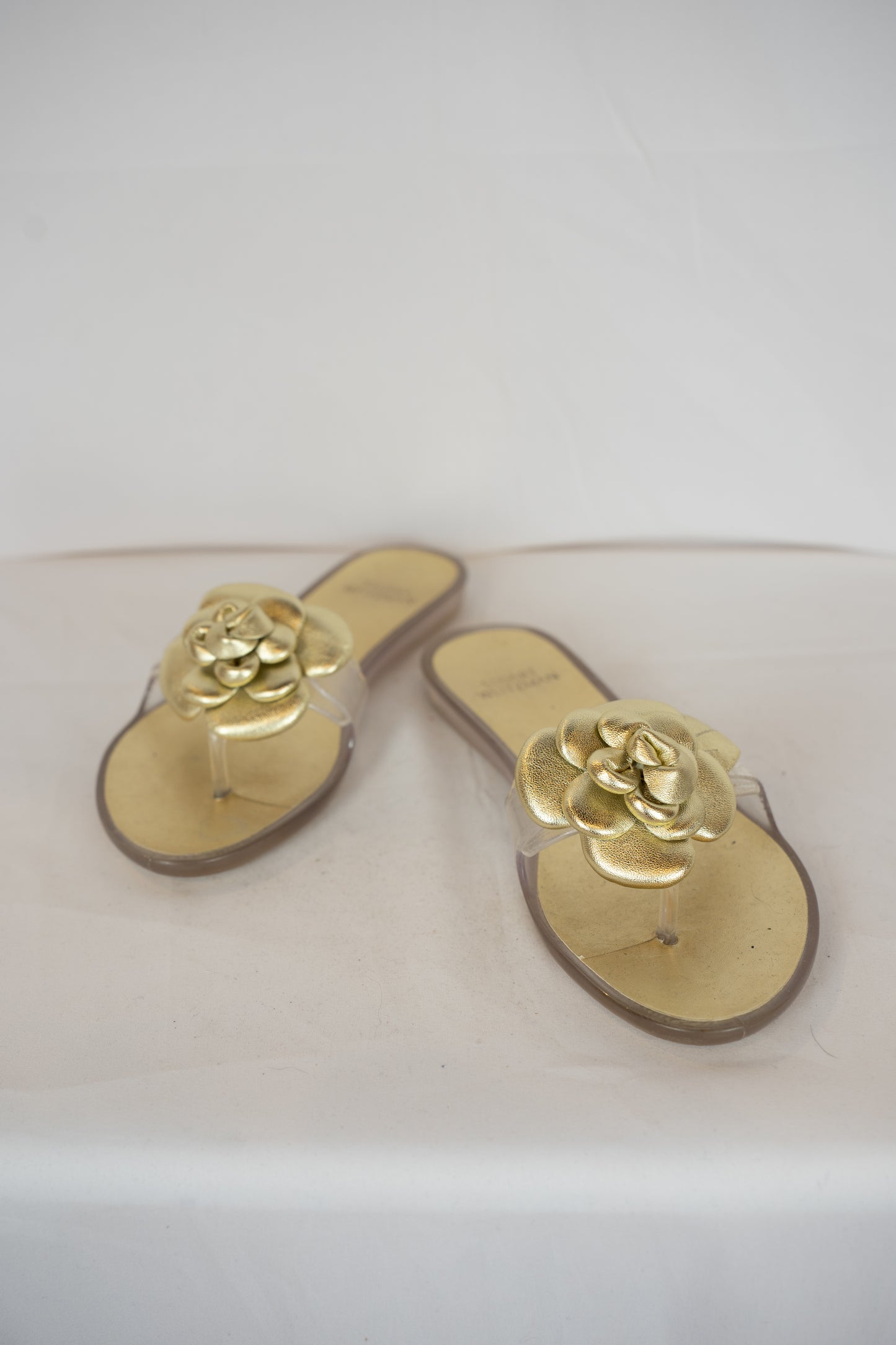 Stuart Weitzman Gold Jelly Flip Flop w/ Flower Detail