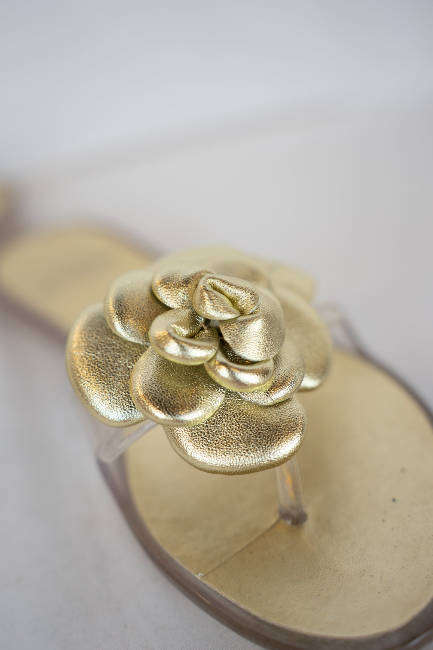 Stuart Weitzman Gold Jelly Flip Flop w/ Flower Detail