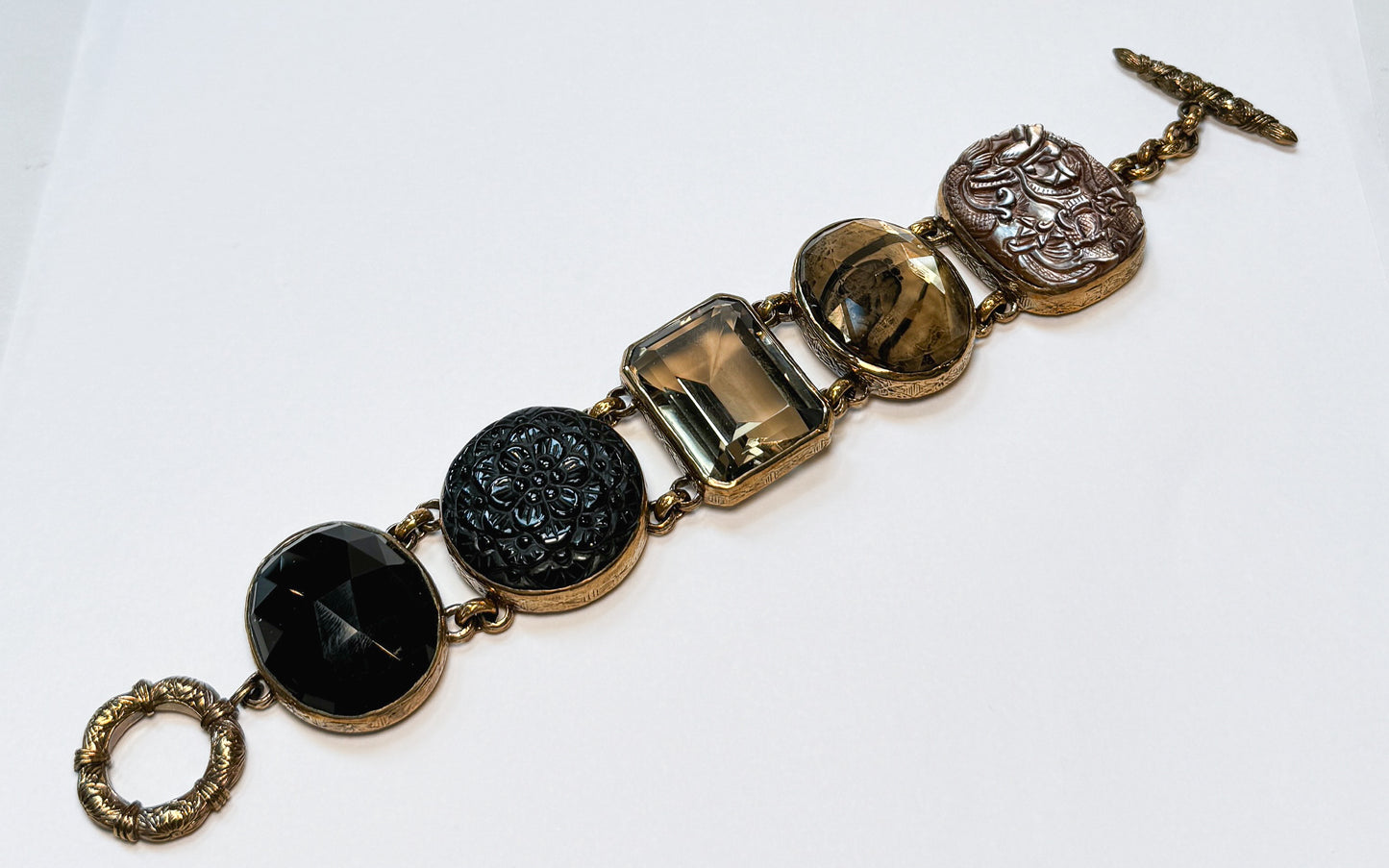 Stephen Dweck Gold Toned Black & Brown Carved Crystal Multi-Stone Link Toggle Bracelet